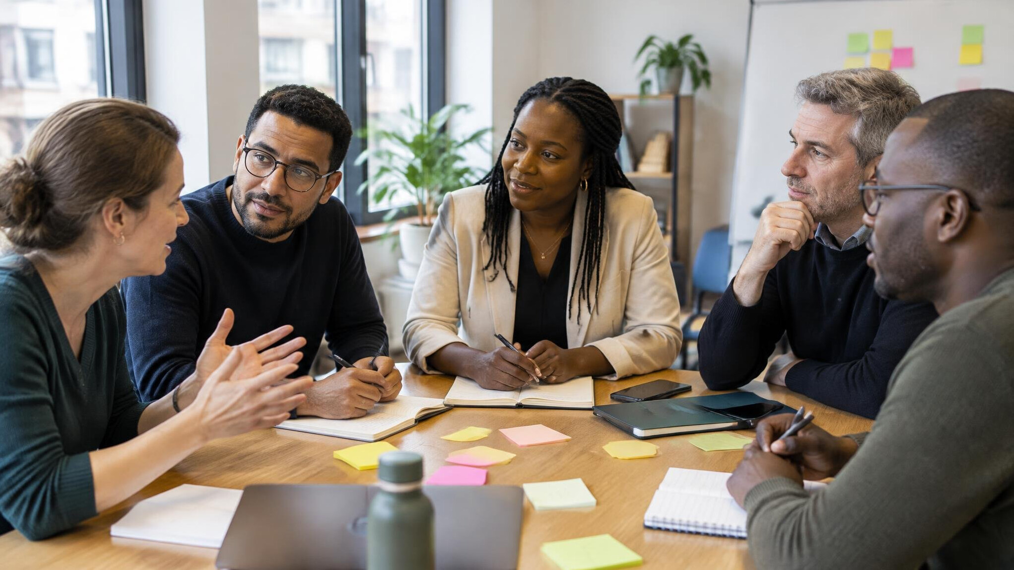 Diverse group of professionals in a leadership workshop discussion